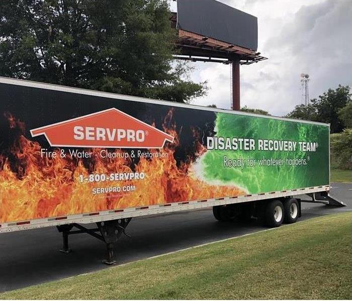SERVRO's Disaster Recovery Team trailer with flames painted on it